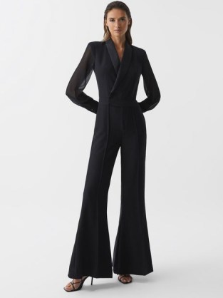 Reiss LENNON TUXEDO JUMPSUIT BLACK | long sheer sleeved flared hem evening jumpsuits | chic evening event fashion | sophisticated party clothes - flipped
