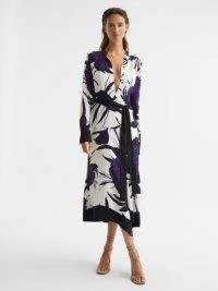 REISS LINA LARGE SCALE FLORAL MIDI DRESS PURPLE – bold flower print dresses with a belted tie waist – chic clothes