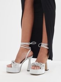 MACH & MACH Double Bow 140 crystal and leather sandals in silver / chunky metallic ankle wrap platforms / luxe retro look occasion footwear / women’s glamorous party high heels / matchesfashion / square open toe platform evening shoes / 70s vintage inspired fashion