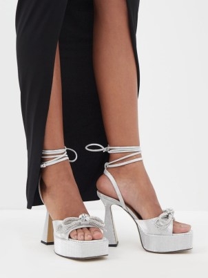 MACH & MACH Double Bow 140 crystal and leather sandals in silver / chunky metallic ankle wrap platforms / luxe retro look occasion footwear / women’s glamorous party high heels / matchesfashion / square open toe platform evening shoes / 70s vintage inspired fashion - flipped