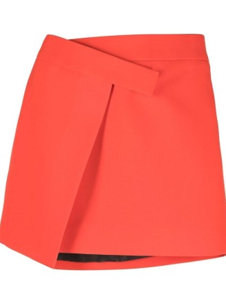 The Attico Cloe asymmetric miniskirt in red ~ bright mini skirts with asymmetrical front ~ farfetch women’s fashion