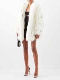 SAINT LAURENT Lynx-spot faux-fur coat in white – glamorous winter coats – occasion glamour – women’s luxury outerwear – MATCHESFASHION – scalloped hem detail – shawl collar – animal spots