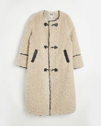 River Island BEIGE FAUX FUR LONGLINE COAT | women’s textured winter coats