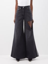 PETER DO Distressed flared-leg jeans in black ~ cut out oversized flares ~ extreme flare hems ~ matchesfashion ~ women’s designer denim