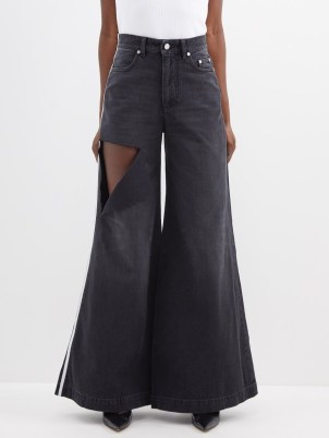 PETER DO Distressed flared-leg jeans in black ~ cut out oversized flares ~ extreme flare hems ~ matchesfashion ~ women’s designer denim - flipped