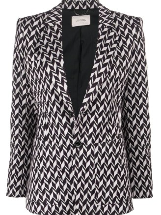 Taylor Swift’s black and white geometric print jacket, Dorothee Schumacher Chevron-Jacquard single-breasted blazer. Worn with a matching sleeveless high neck top and flared trousers, appearing on The Tonight Show with Jimmy Fallon, 24 October 2022 | celebrity blazers | star fashion - flipped