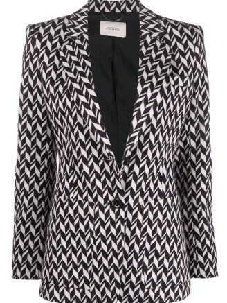 Taylor Swift’s black and white geometric print jacket, Dorothee Schumacher Chevron-Jacquard single-breasted blazer. Worn with a matching sleeveless high neck top and flared trousers, appearing on The Tonight Show with Jimmy Fallon, 24 October 2022 | celebrity blazers | star fashion
