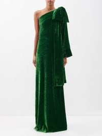BERNADETTE Nel one-shoulder bow-appliqué velvet gown ~ luxe green gowns ~ occasionwear with statement bows ~ event clothes with asymmetric neckline ~ matchesfashion