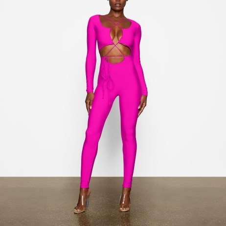 SKIMS LACE UP CATSUIT ~ fitted fuchsia pink catsuits ~ vibrant skinny form fitting jumpsuits - flipped