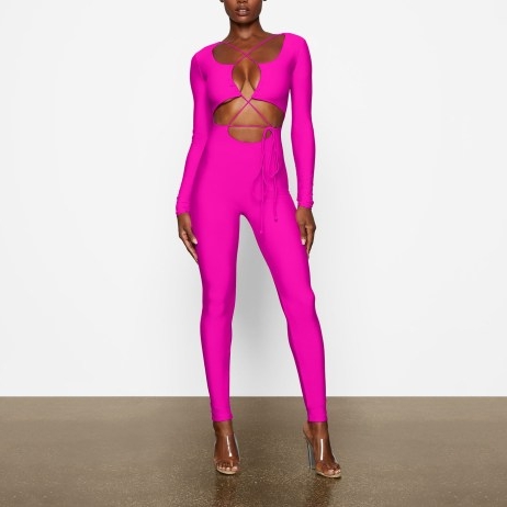 SKIMS LACE UP CATSUIT ~ fitted fuchsia pink catsuits ~ vibrant skinny form fitting jumpsuits