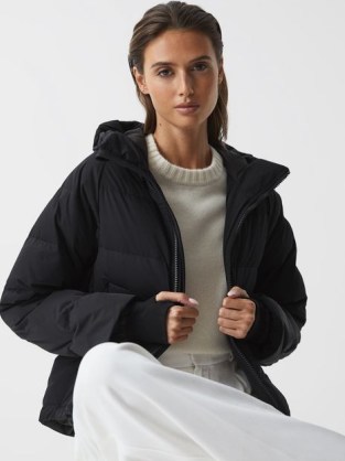 REISS ARYA SHORT PUFFER JACKET BLACK – women’s hooded thumbhole winter jackets – womens warm quilted outerwear – thumb hole detail – padded – zip up closure - flipped