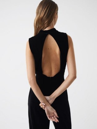 REISS DIANE SLEEVELESS VELVET JUMPSUIT BLACK – chic high neck evening jumpsuits – cut out open back detail – women’s elegant all-in-one party fashion - flipped