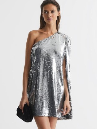 EVA SEQUIN CAPE ONE SHOULDER MINI DRESS SILVER – glamorous evening event dresses – women’s shimmering sequinned party clothes – occasion glamour – asymmetric neckline