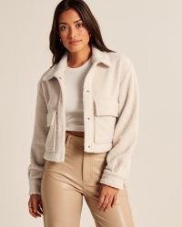 Abercrombie & Fitch Cropped Sherpa Shirt Jacket in Cream – women’s faux shearling crop hem jackets