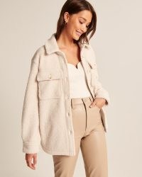 Abercrombie & Fitch Sherpa Shirt Jacket in Cream – faux shearling shackets – womens textured over shirts