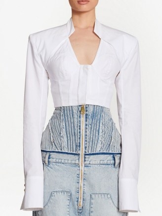 Balmain cropped cotton blouse in white | long sleeved bustier style tops | over extended cuffs | fitted bodice fashion - flipped