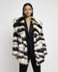 RIVER ISLAND BLACK ANIMAL PRINT FAUX FUR COAT – monochrome winter coats – women’s glamorous vintage style fashion