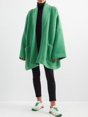 Kendall Jenner’s green knitted wide sleeved jacket, THE ROW Stowe oversized alpaca-blend coat. Worn with a matching scarf. On Justine Skye’s Instagram, 22 November 2022 | celebrity social media coats | models off duty fashion | reality star knitwear style