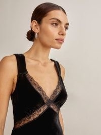 Taylot Swift’s black sleeveless lace panel slip dress, Reformation Lorenzo Velvet Dress. On Instagram, 4 November 2022 | celebrity social media fashion | dresses