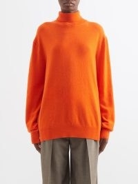 THE ROW Ciba cashmere roll-neck sweater in orange / vibrant relaxed fit high neck sweaters / women’s luxury drop shoulder jumpers