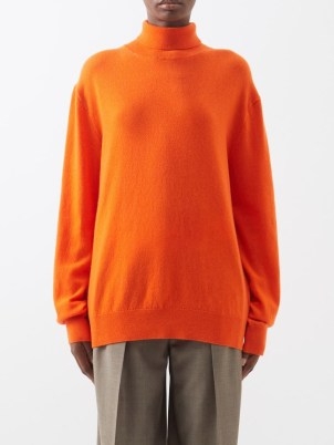 THE ROW Ciba cashmere roll-neck sweater in orange / vibrant relaxed fit high neck sweaters / women’s luxury drop shoulder jumpers - flipped