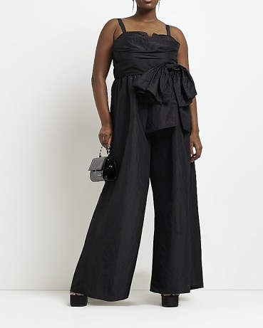 River Island PLUS BLACK FRILL JUMPSUIT | feminine plus size sleeveless jumpsuits | women’s bow detail all-in-one | party fashion
