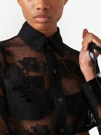 Prada embroidered-logo Chantilly lace shirt in black – luxe semi sheer floral shirts – women’s designer crop tops – cropped collared blouses - flipped