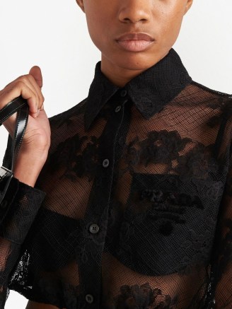Prada embroidered-logo Chantilly lace shirt in black – luxe semi sheer floral shirts – women’s designer crop tops – cropped collared blouses