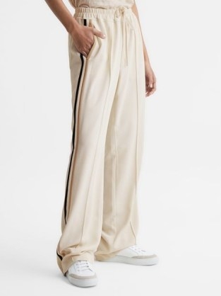 REISS ODELL WIDE LEG PULL ON TROUSERS CREAM / women’s loose fit joggers / sports luxe jogging bottoms / womens sportwear inspired fashion - flipped