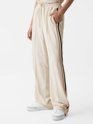 REISS ODELL WIDE LEG PULL ON TROUSERS CREAM / women’s loose fit joggers / sports luxe jogging bottoms / womens sportwear inspired fashion