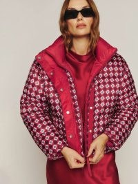 Canada Goose x Reformation Lorita Puffer in Arcade/Lipstick – luxe reversible padded jackets – chic printed winter coats
