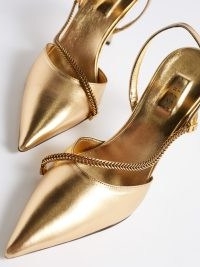 SERENA UZIYEL Sienna 90 metallic-leather slingback pumps in gold – luxe slingbacks with a sharp pointed toe – glamorous occasion shoes – chain strap detail evening heels