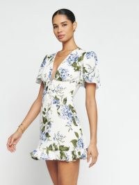 Reformation Mya Dress in Riviera | deep V-neck ruffle hem mini dresses | short flutter sleeved frock | feminine floral fashion | plunge front neckline clothes