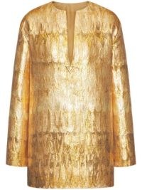 Olivia Culpo’s gold tunic style top, Valentino Golden Wings brocade minidress. Worn with matching trousers, a pair of black patent platforms, oversized rectangular sunnies and carrying a small metallic bag. On Instagram, 8 December 2022 | celebrity street style fashion | social media mini dresses