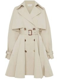 Alexander McQueen A-line pleated trench coat in beige | women’s belted flared hem coats