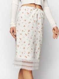 Reformation Emery Skirt in Elia / feminine floral print skirts / sheer hemline / slender ties at waist