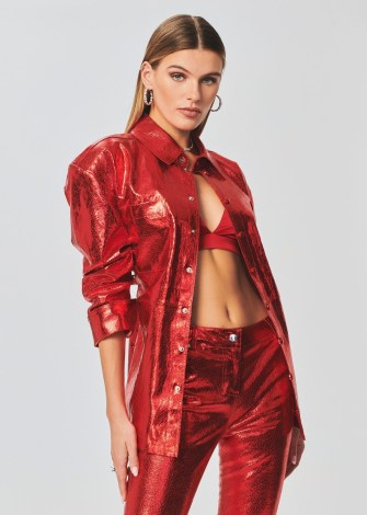 Olivia Culpo’s red metallic shirt, Retrofête MERCURY LEATHER SHIRT. Worn with a pair of matching trousers and a satin bralette. On Instagram, 8 January 2023 | celebrity social media fashion - flipped