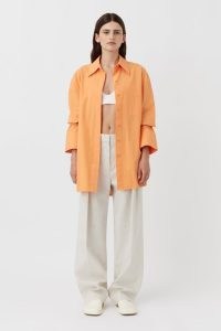CAMILLA AND MARC Sable Cotton Button-Up Shirt in Persimmon Orange / women’s oversized curved hem shirts