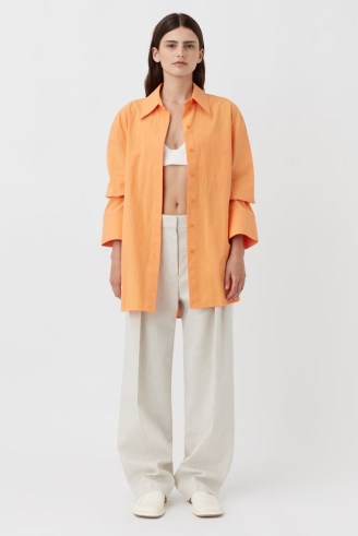 CAMILLA AND MARC Sable Cotton Button-Up Shirt in Persimmon Orange / women’s oversized curved hem shirts