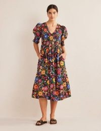 Boden Smocked Bodice Midi Dress in Black, Gardenia Pop | floral puff sleeve dresses