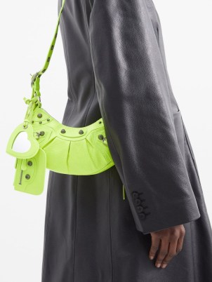 BALENCIAGA Le Cagole XS leather shoulder bag in yellow – small studded neon bags – bright stud detail handbags - flipped