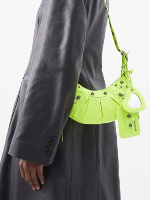 BALENCIAGA Le Cagole XS leather shoulder bag in yellow – small studded neon bags – bright stud detail handbags