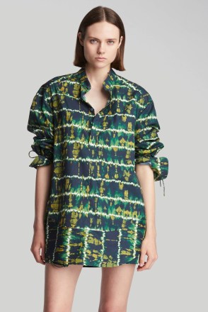Emma Roberts’ dark green tie dye shirt, Altuzarra Amara top. For the Saks Fifth Avenue Spring Fashion Campaign, 7th February 2023. Worn with a matching mini skirts and ankle strap sandals | celebrity photoshoot fashion - flipped