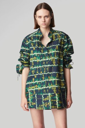 Emma Roberts’ dark green tie dye shirt, Altuzarra Amara top. For the Saks Fifth Avenue Spring Fashion Campaign, 7th February 2023. Worn with a matching mini skirts and ankle strap sandals | celebrity photoshoot fashion
