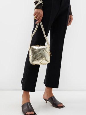 BOTTEGA VENETA Cassette mini Intrecciato-leather cross-body bag in gold / small shiny metallic crossbody bags ~ luxury designer handbags
