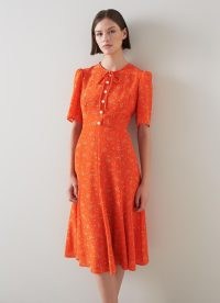 L.K. Bennett Montana Orange Flower Bow Print Silk Tea Dress | women’s luxury retro clothes | ditsy floral print short sleeve fit and flare dresses | luxe vintage fashion