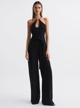 Reiss HALSTON EMA HALTER NECK WIDE LEG JUMPSUIT in BLACK / glamorous halterneck jumpsuits / chic 70s style all-in-one occasion clothes / women’s party fashion