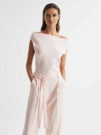 REISS MAPLE OFF-THE-SHOULDER JUMPSUIT NUDE ~ pale pink jumpsuits ~ belted tie waist ~ asymmetric neckline ~ women’s occasion clothes ~ womens chic all-in-one evening clothing