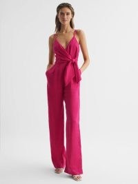 Reiss EMILIA V-NECK LINEN JUMPSUIT in Pink / strappy plunge front jumsuits / women’s all-in-one evening fashion / womens occasion clothes / belted self tie waist