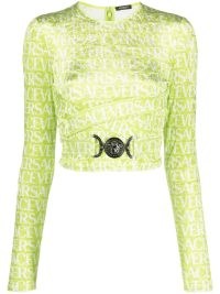Versace logo-print cut-out crop top in lime green/white ~ women’s citrus coloured fashion ~ luxury long sleeve crop tops ~ cropped fashion ~ women’s designer clothes